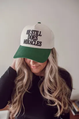 He Still Does Miracles Trucker Hat